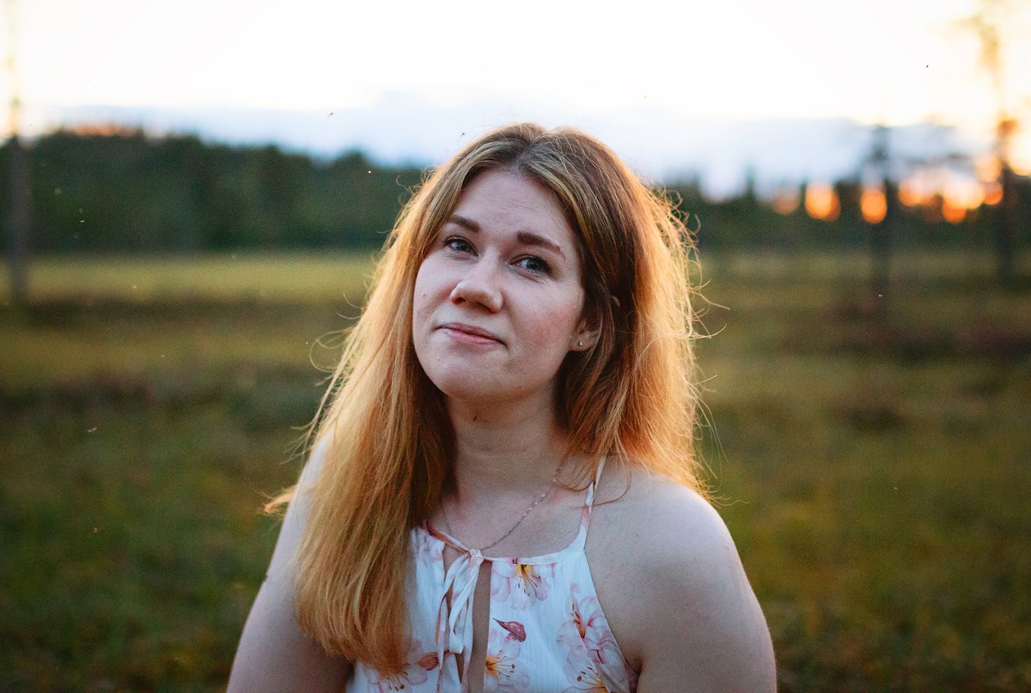 Golden hour portrait in nature with soft sunset lighting.