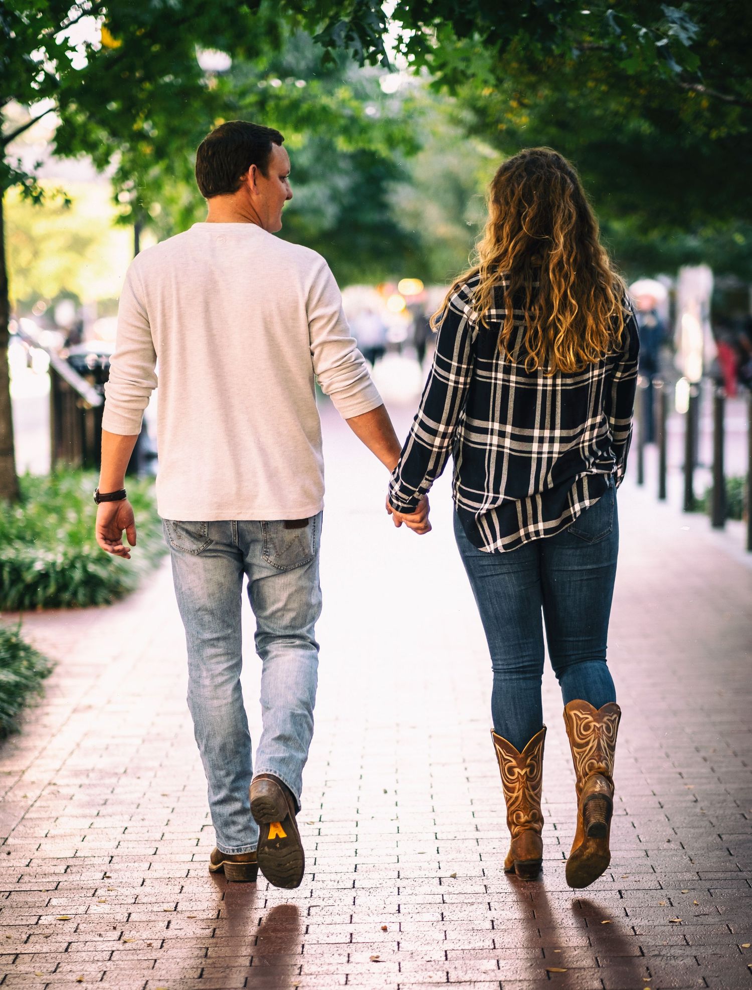 Couple walking for engagement photo in Ft Worth, Texas