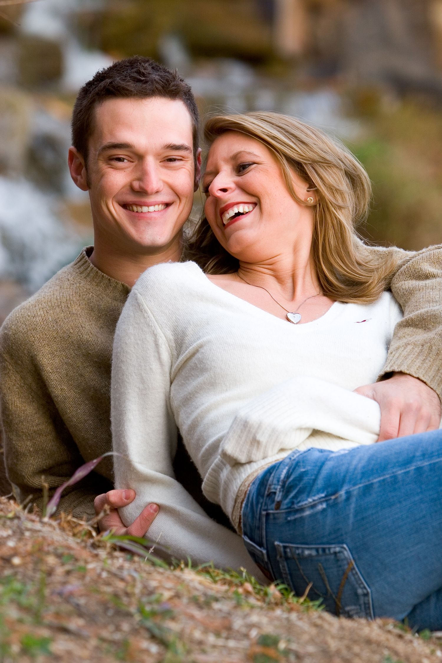 Couple sitting on the ground for engagement photo in Dallas, Texas