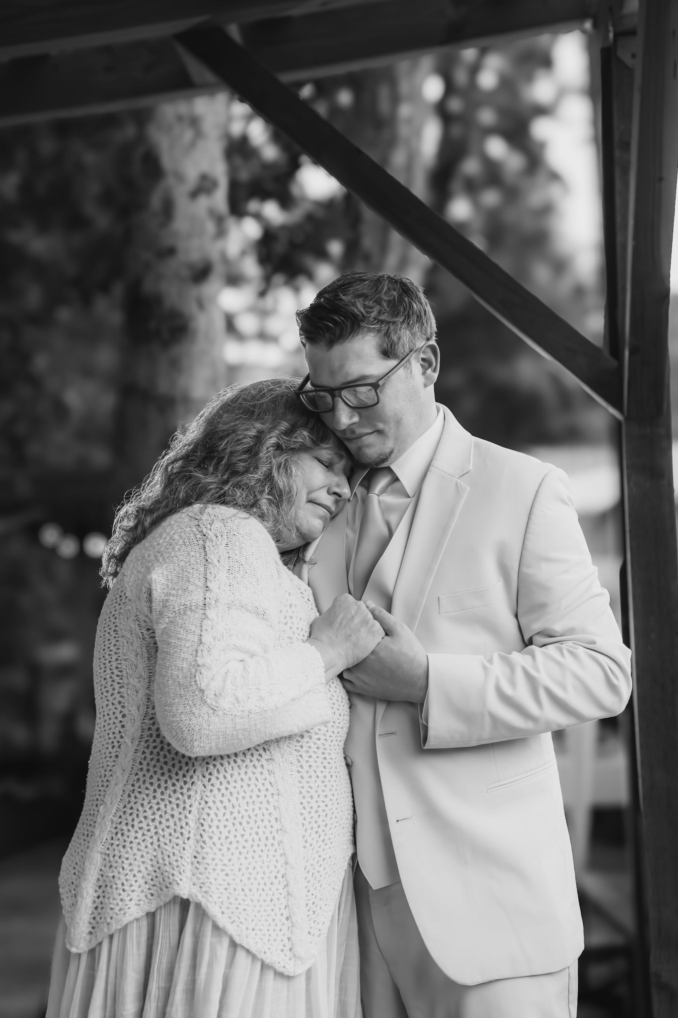 groom hugs his mother during the dance
