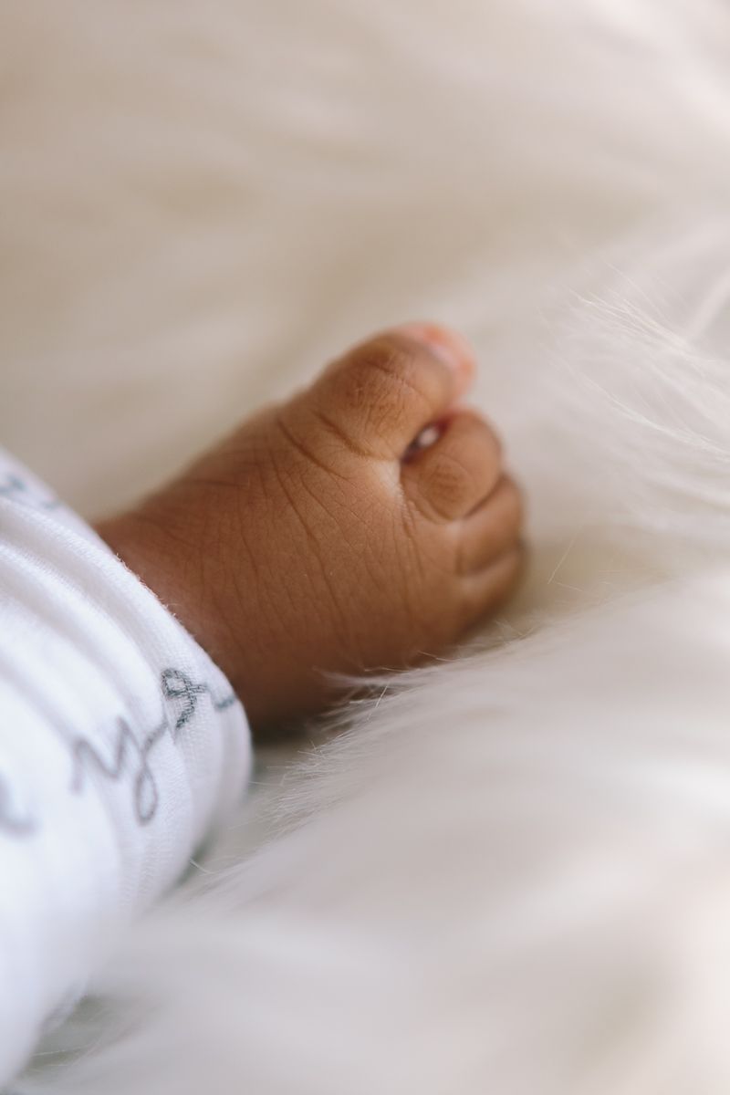 a close up detail of a newborn's baby foot during a newborn session by NY Family Photographer Paula Brearley NYC newborn photographer
