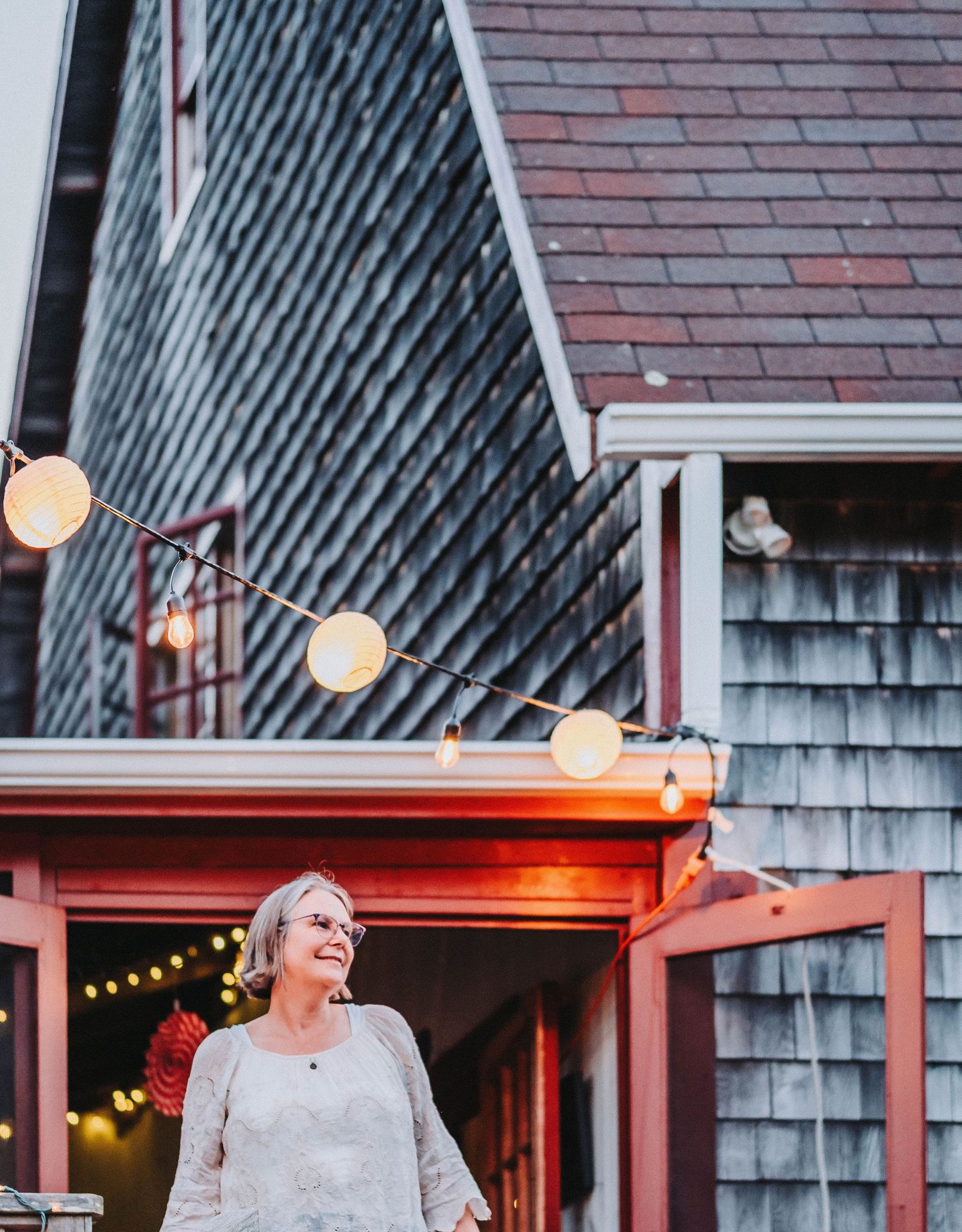 The head chair of the board of a summer camp in Maine smiles during their annual fundraiser event.
