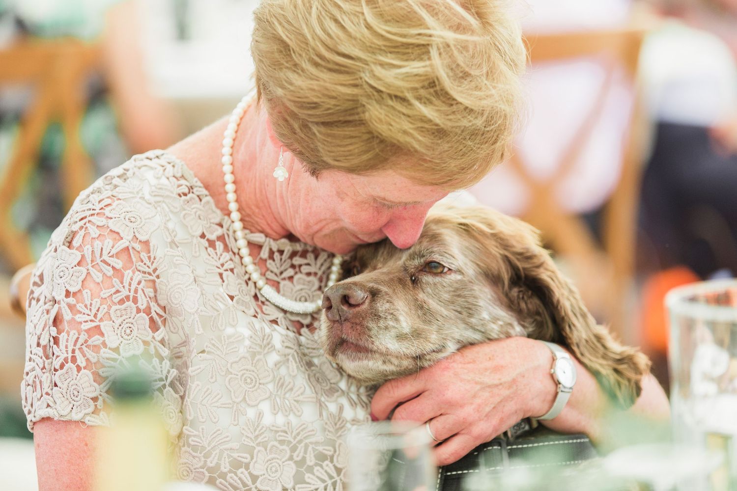 Hayley Elizabeth Photography Dogs at weddings bride's mum giving spaniel kiss during speeches in the cotswolds southrop