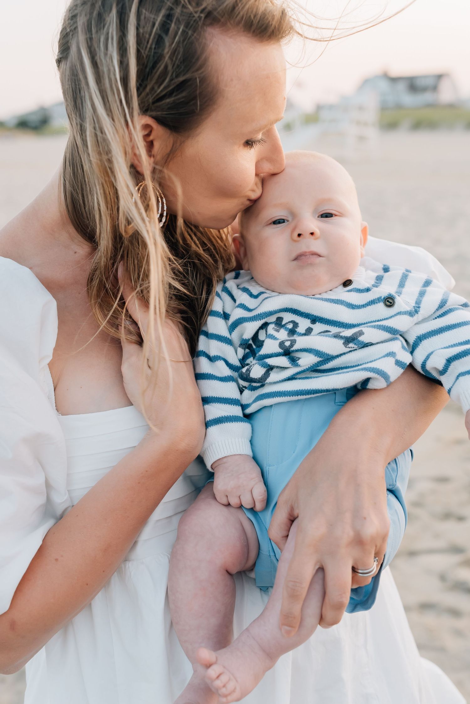 A mother embraces her son at their extended family photo session in Spring Lake, NJ.