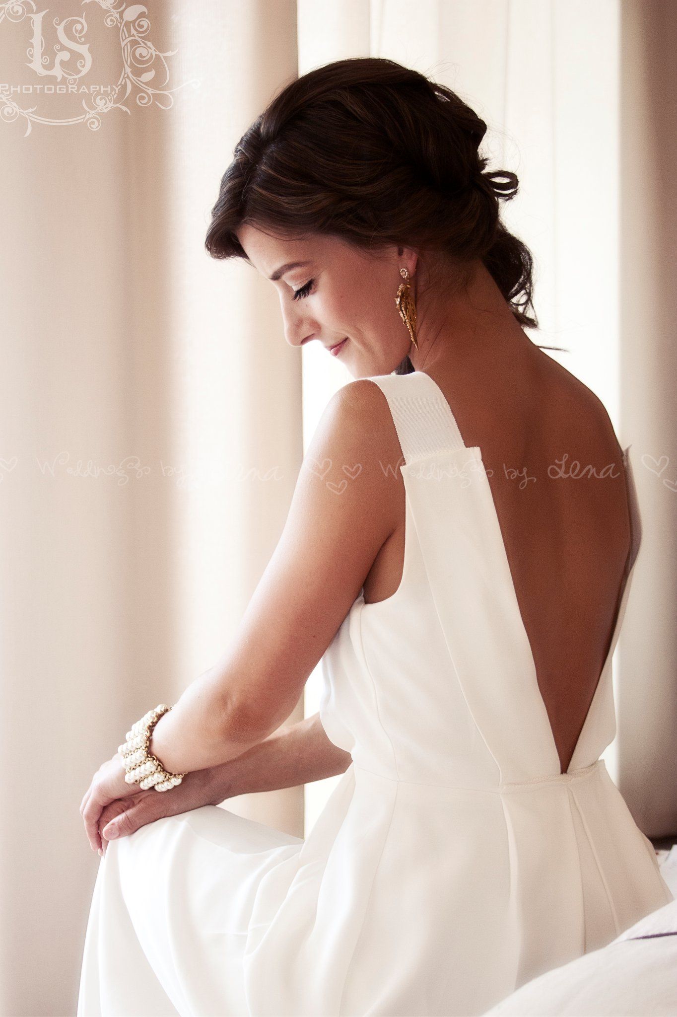 Elegant bridal portraits showing the back details of a white wedding gown against soft curtains.