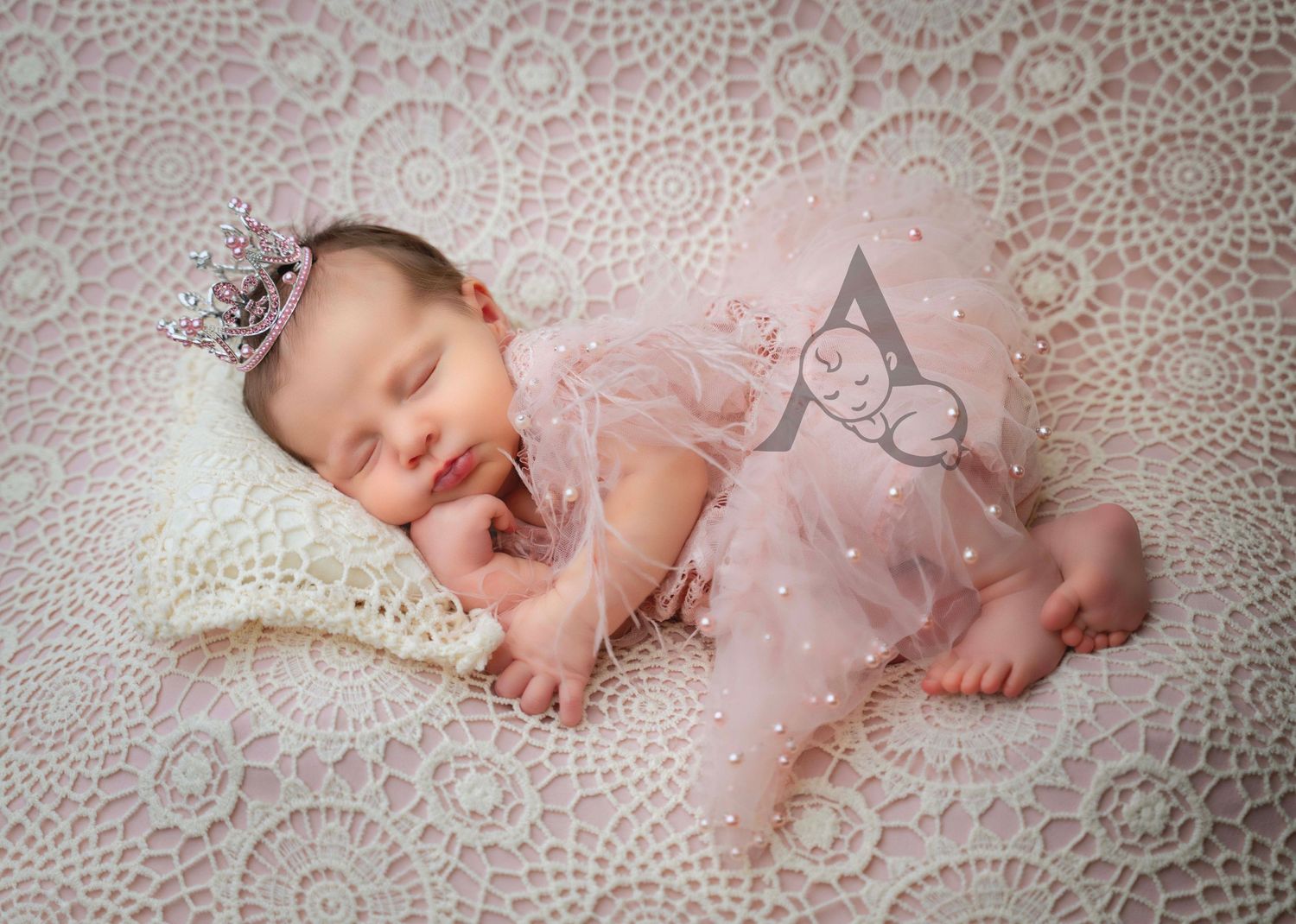 Delicate portrait of sleeping baby in pink tulle dress on lace background.