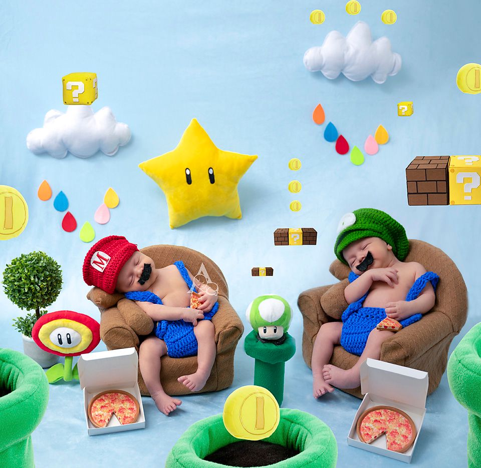Creative Super Mario themed newborn photography with gaming props and decorations.