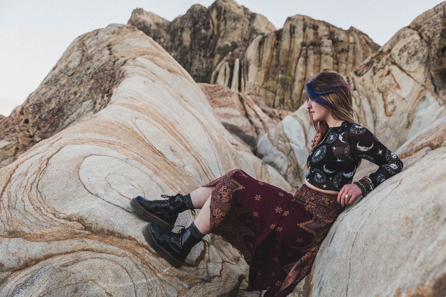 Moon Rocks Desert Nevada Senior Photo with pink and blue hair and black crop top and bohemian skirt Dr. Marten boots