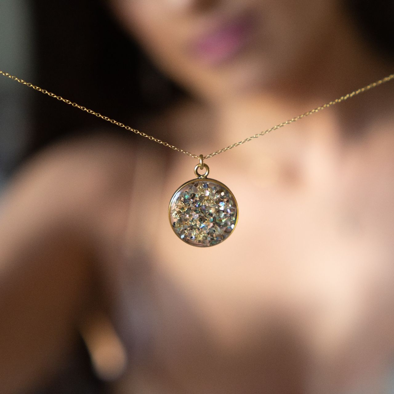 necklace being hold by a woman