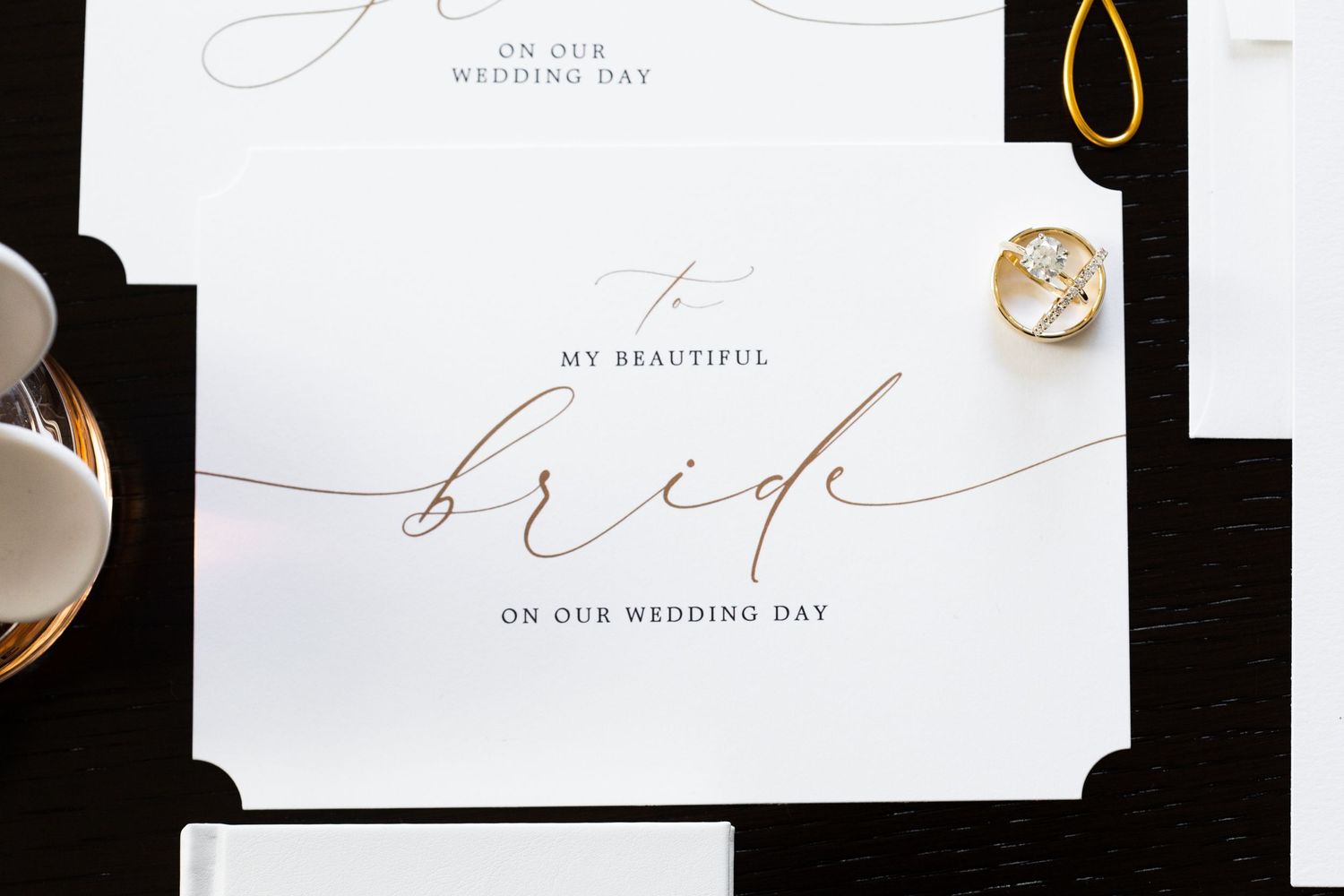 Elegant wedding stationery with calligraphy text and minimalist design on white background.