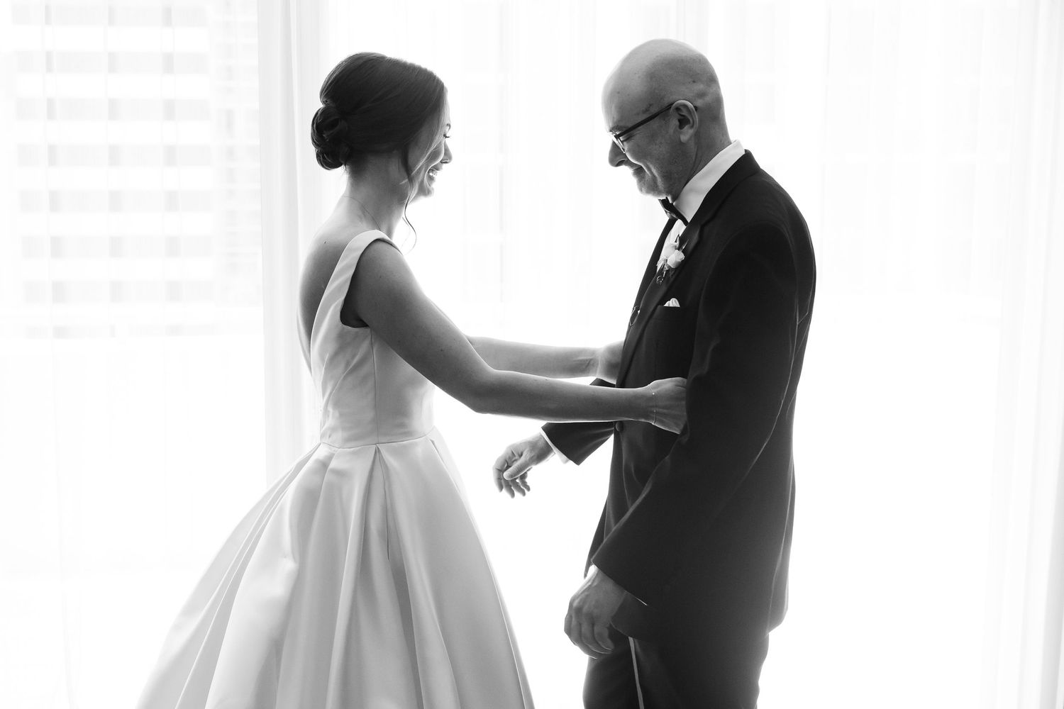 Black and white photos show tender pre-wedding moments in a sunlit room.