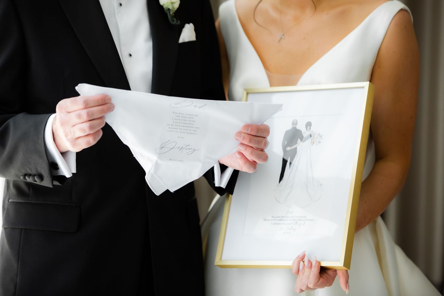Couple reading personal letters together on their wedding day.