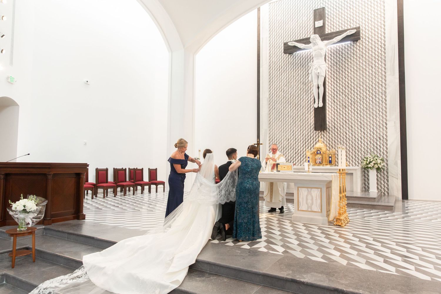 Modern church interior with distinctive geometric wall patterns and bright lighting.