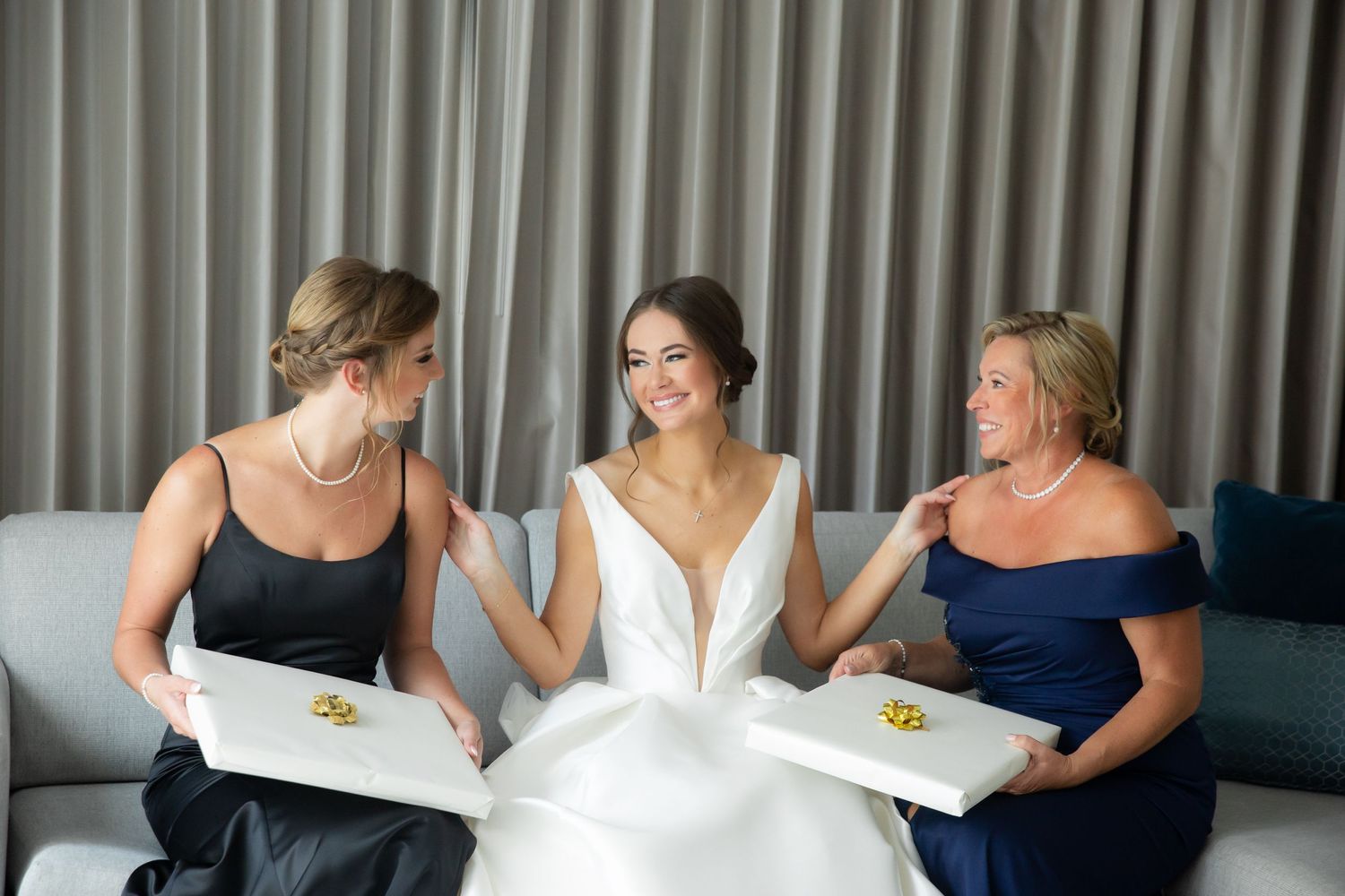 Candid moment of wedding party preparations in hotel room.