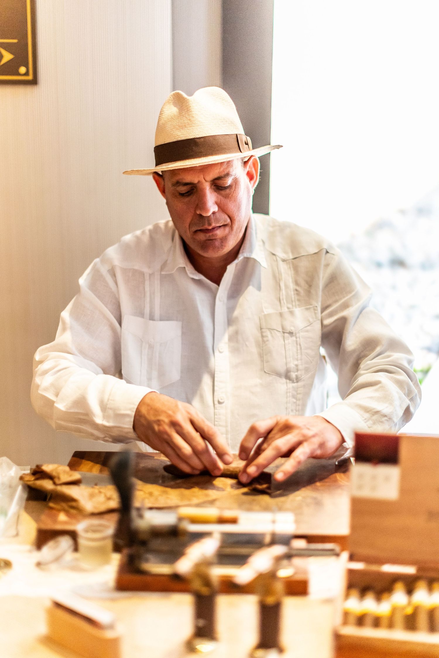 Food preparation scene with chef working on artisanal dishes in white uniform.