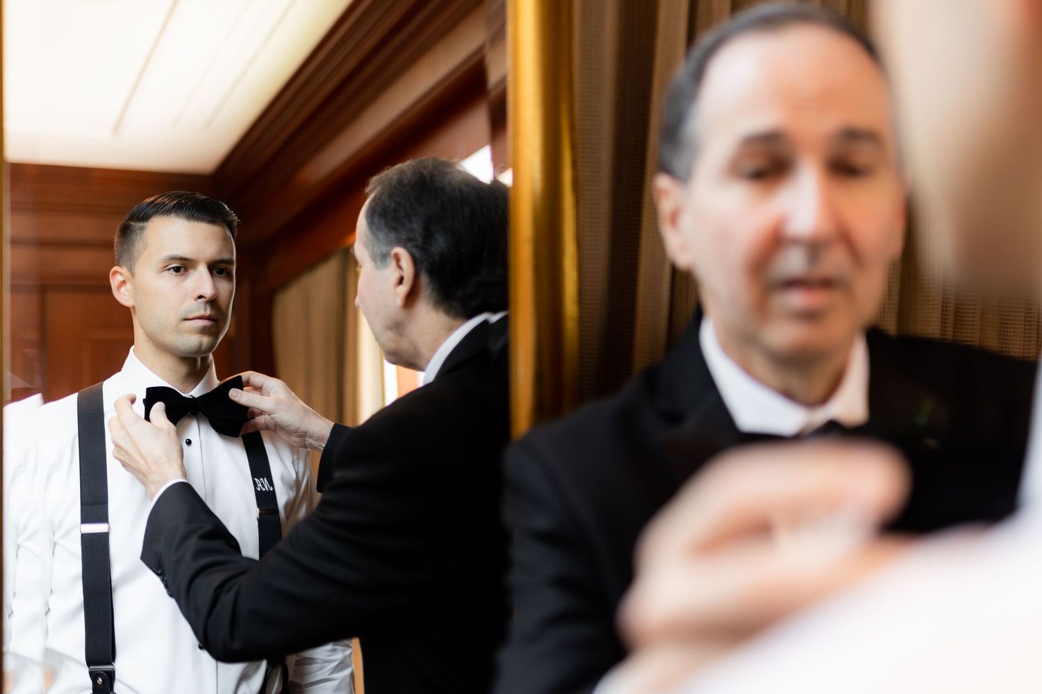 Formal wedding preparation moments captured in natural light.