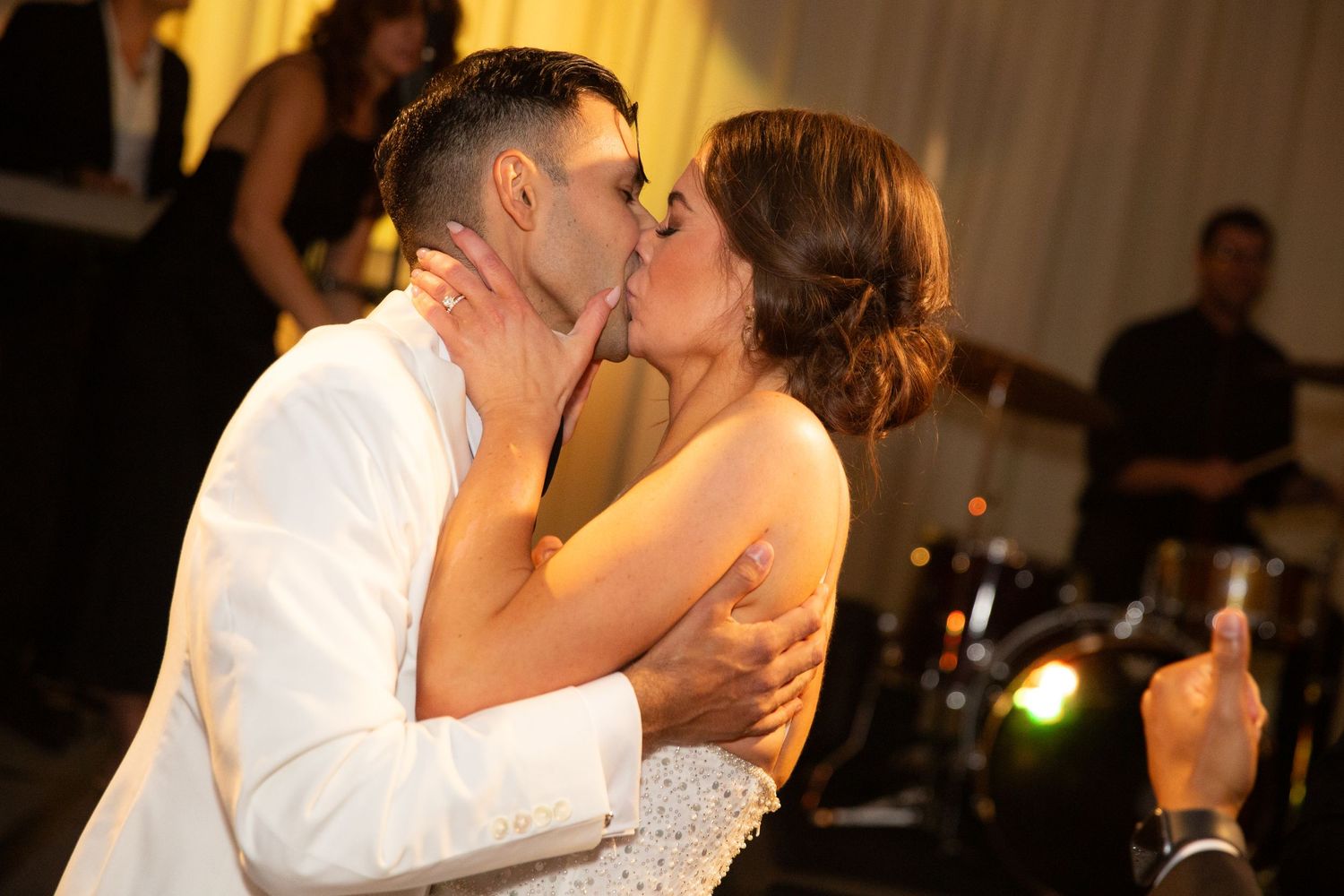 Romantic dance moment captured at evening wedding reception.