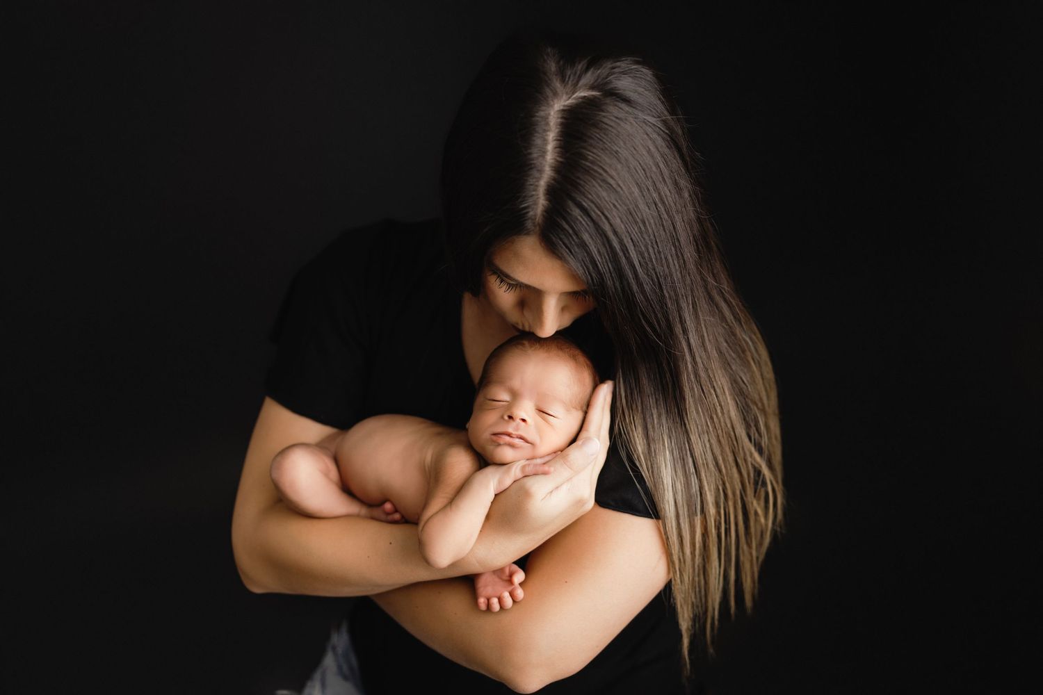 mom holding baby riverview newborn photographer