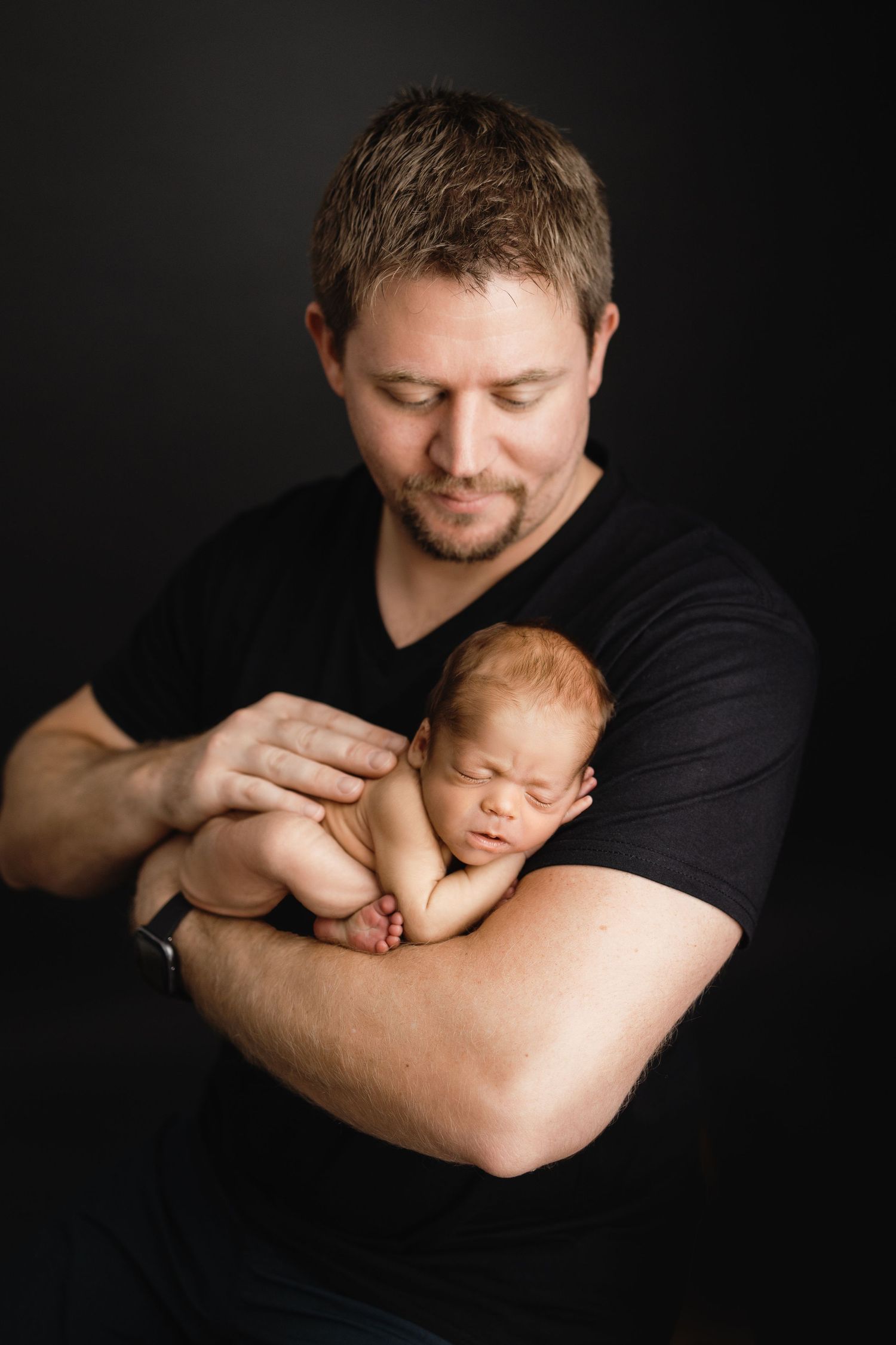 dad holding baby tampa newborn photographer