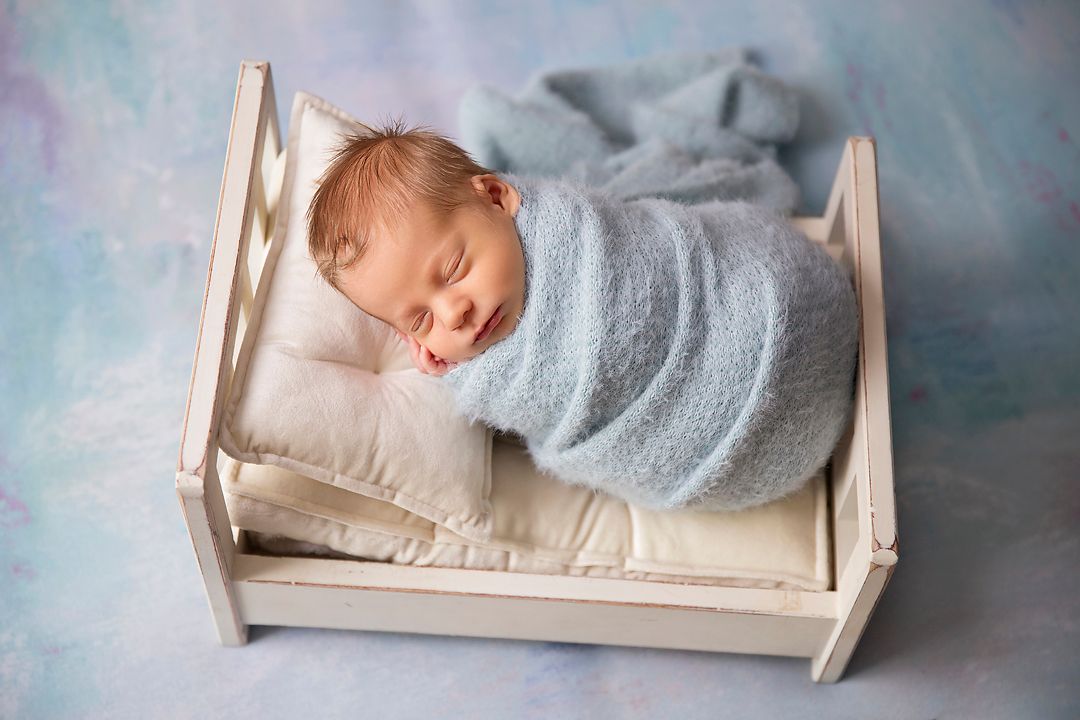 Newborn baby boy in blue