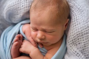 newborn baby boy in blue