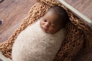 sleeping babe in tiny bed