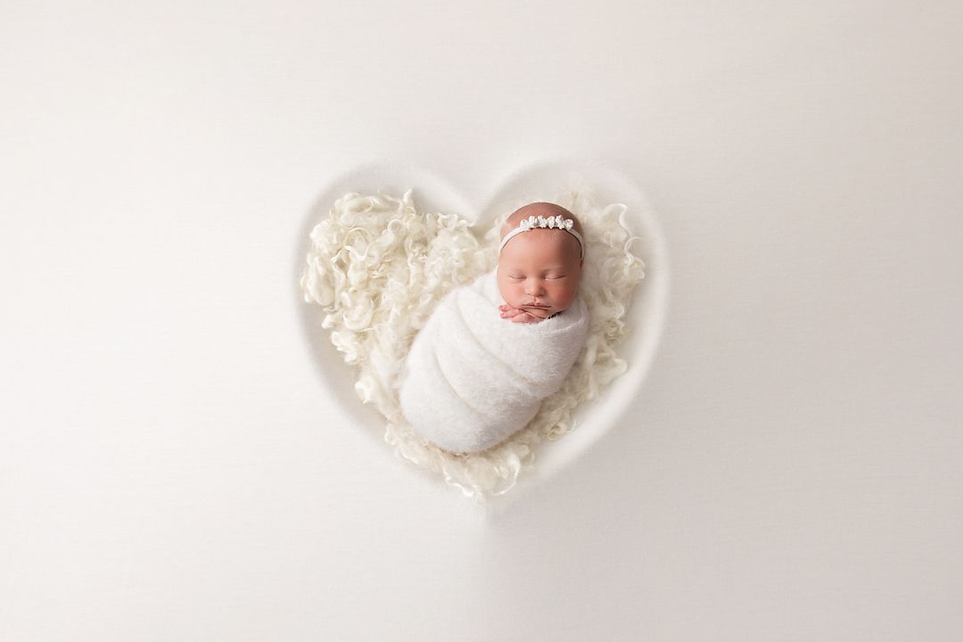 newborn baby white heart