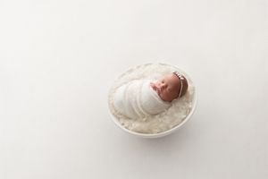 newborn baby girl white neutral bowl