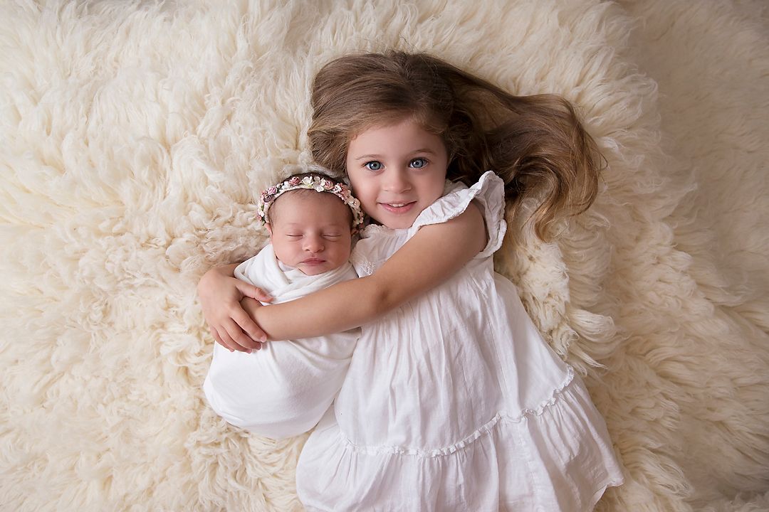 newborn baby and sibling