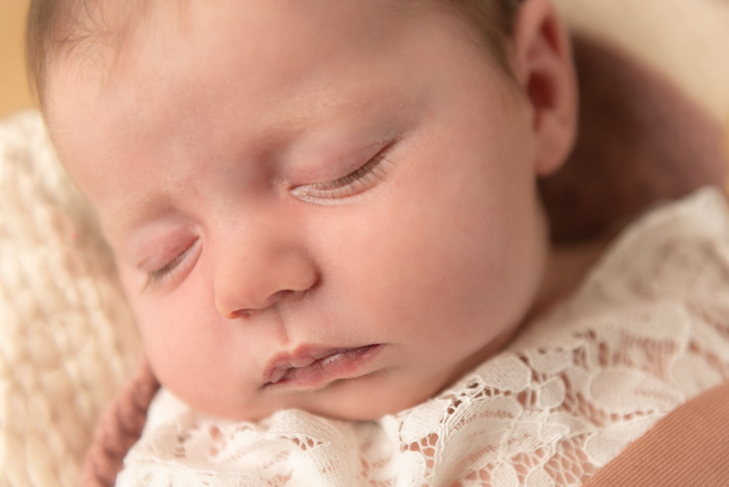 newborn baby girl photo lace doutfit close up sleeping
