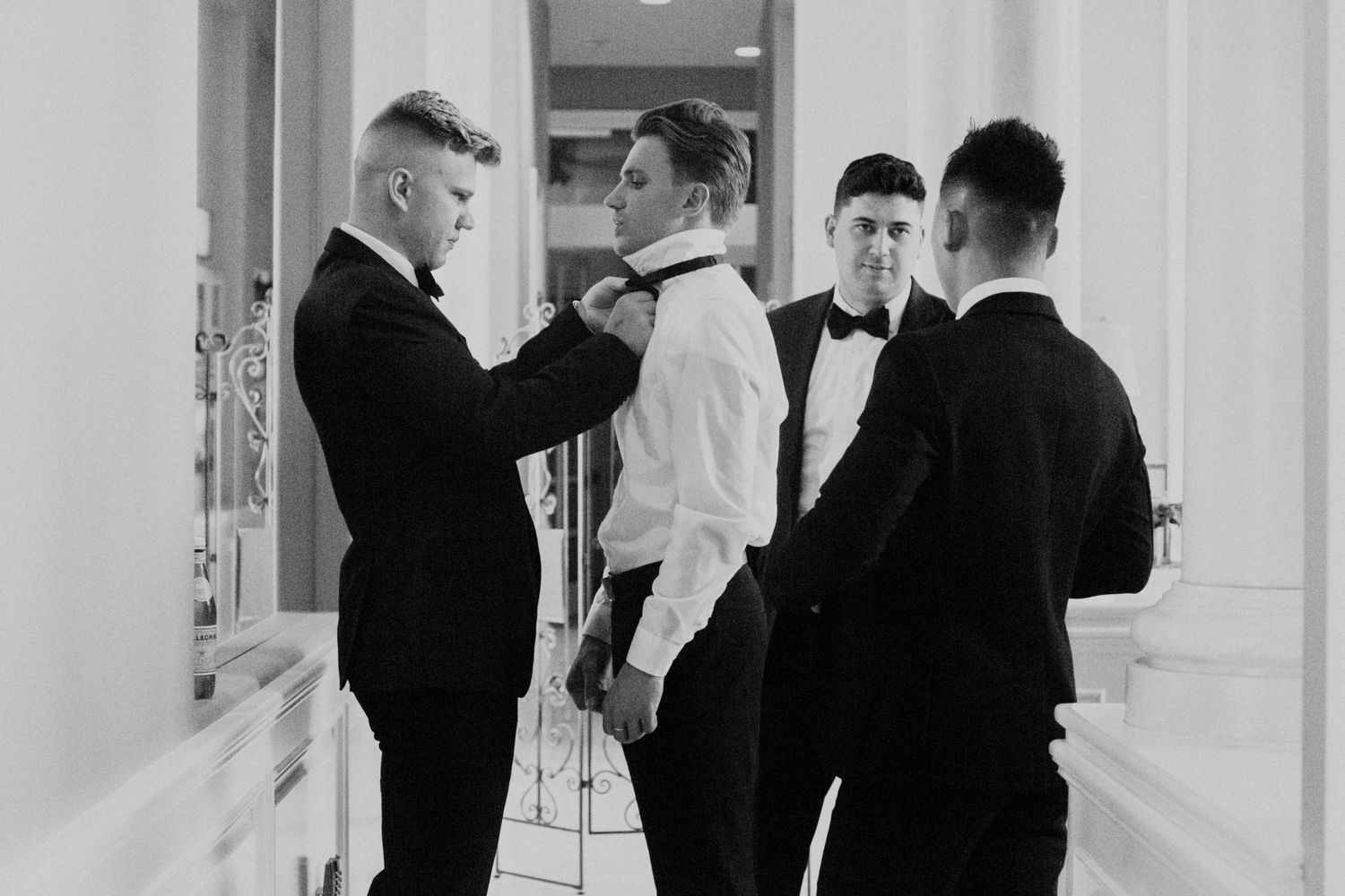 groomsmen getting ready with groom