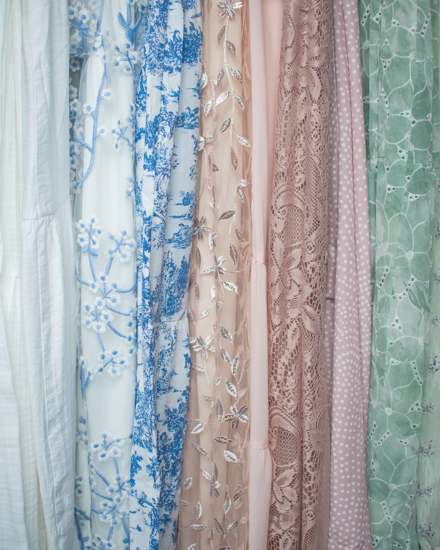 ashley line photography close up image of dresses from motherhood wardrobe, so clients can see their colorful fabrics