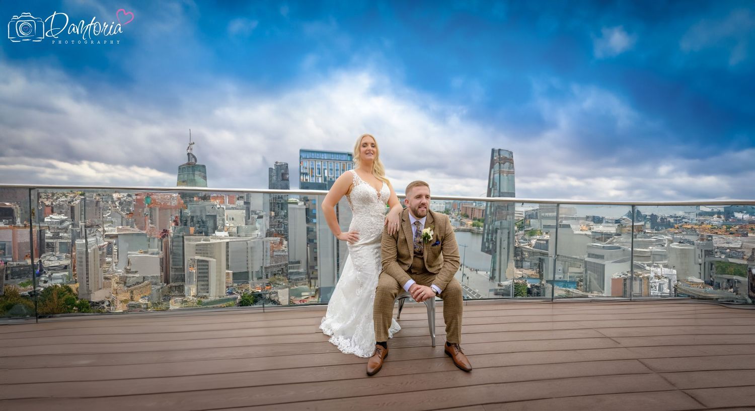 Panoramic cityscape wedding photo series showing an urban skyline and a couple in formal attire against a dramatic blue sky.