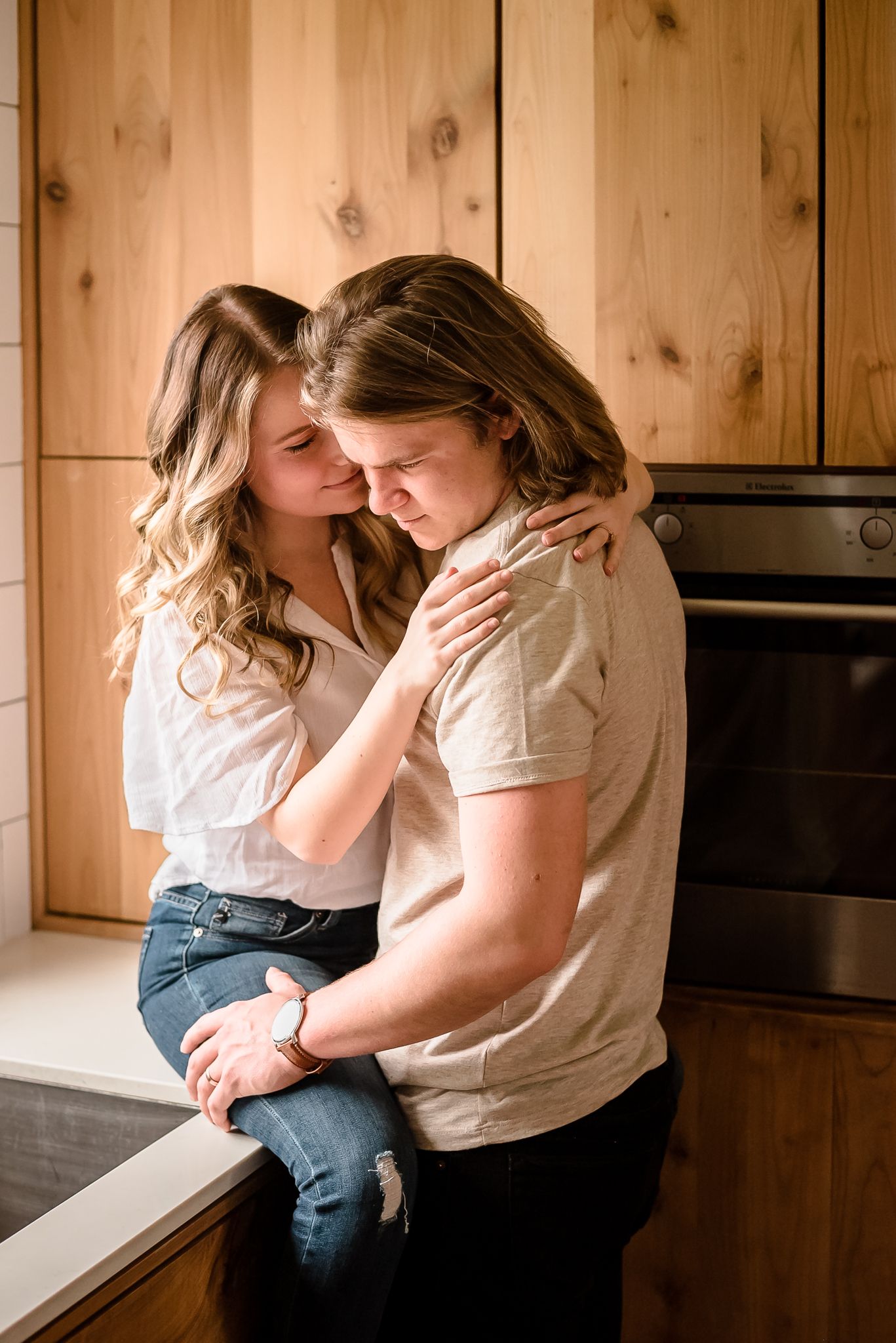 A woman smiles lovingly at her husband during a lifestyle photoshoot in Chilliwack, BC.