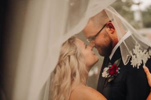 Bride and Groom veil shot