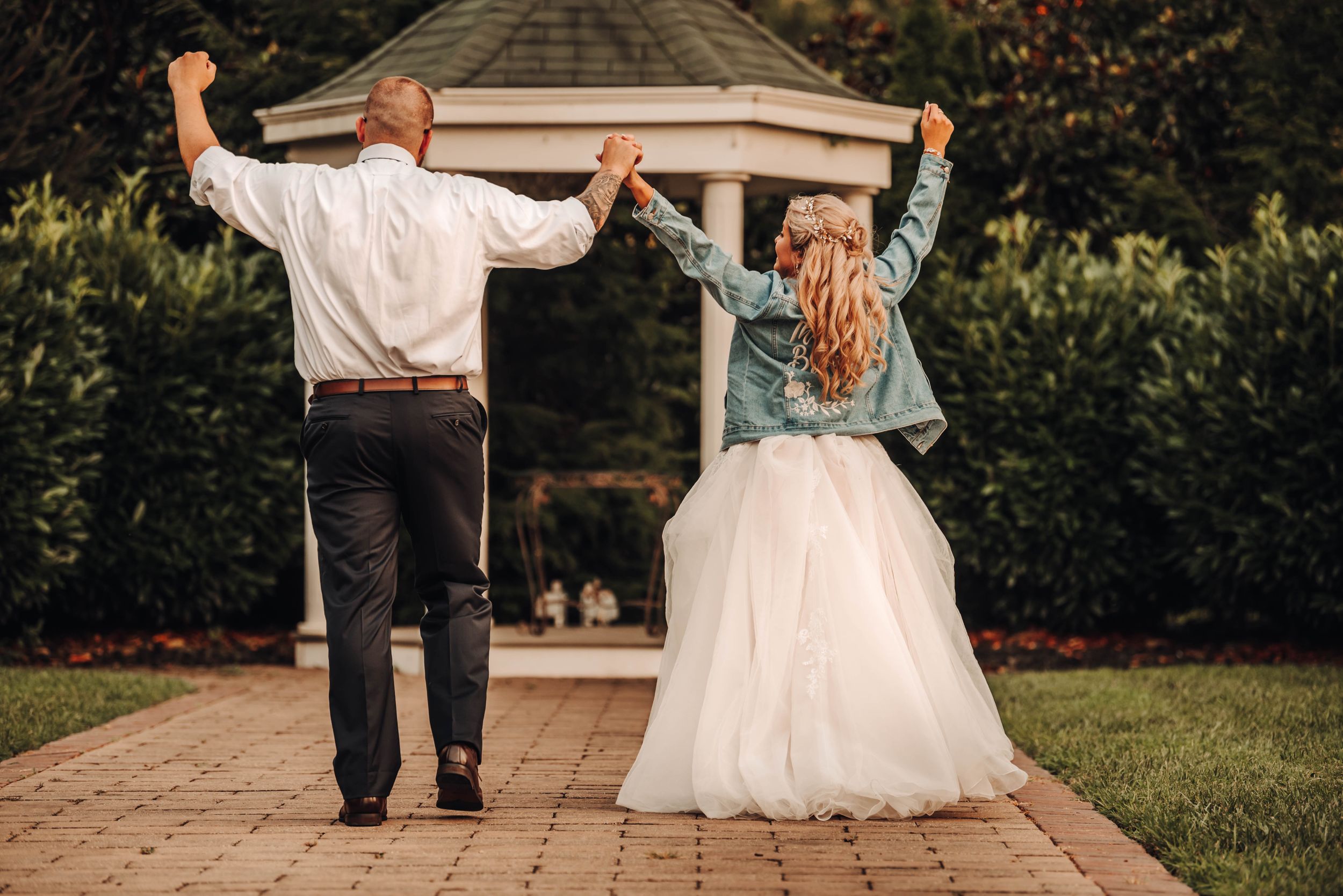 Bride and Groom hands in the air