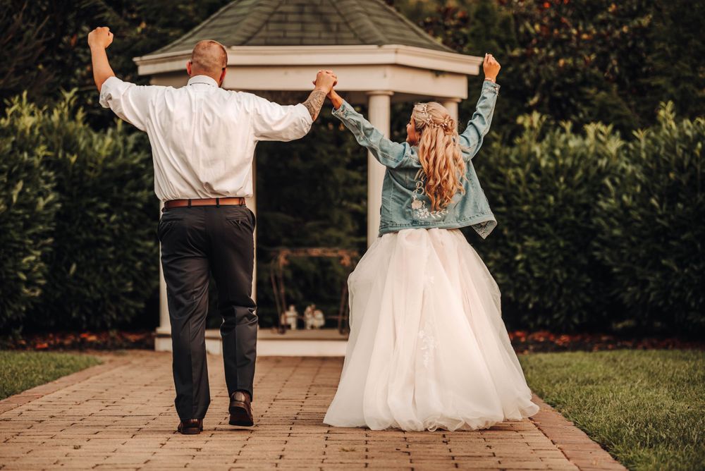 Bride and Groom hands in the air