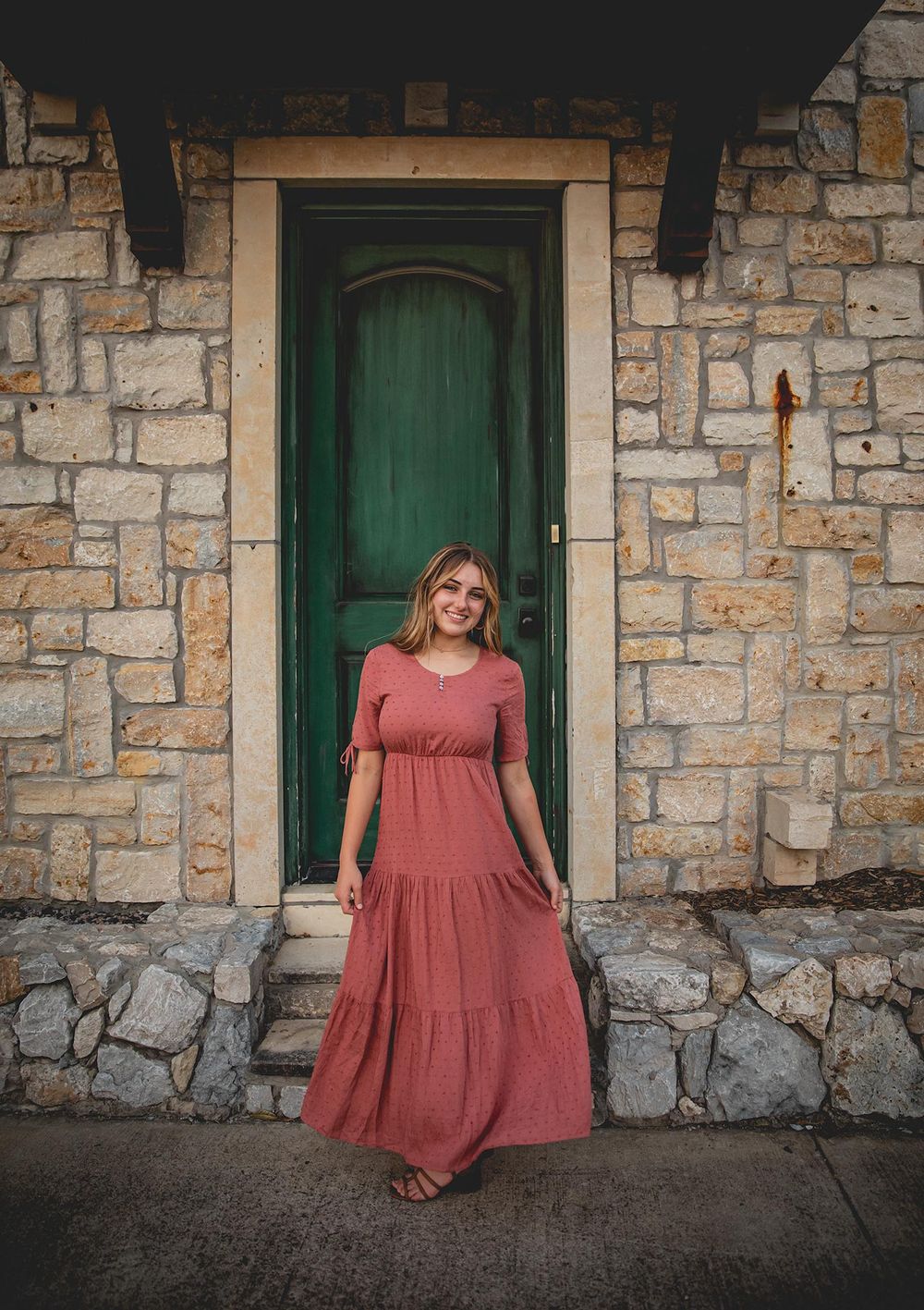 senior girl photography session in front of green door