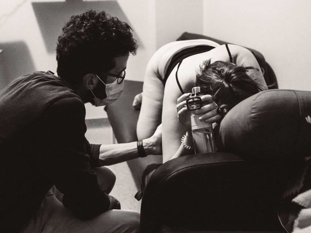 Series of black and white photographs showing nurturing moments with a baby.