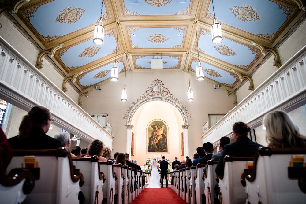 Ornate church ceiling with decorative gold details and painted medallions.