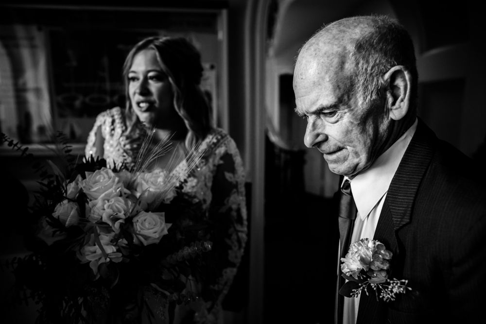 A series of black and white photos showing wedding guests enjoying cigars during an evening celebration.