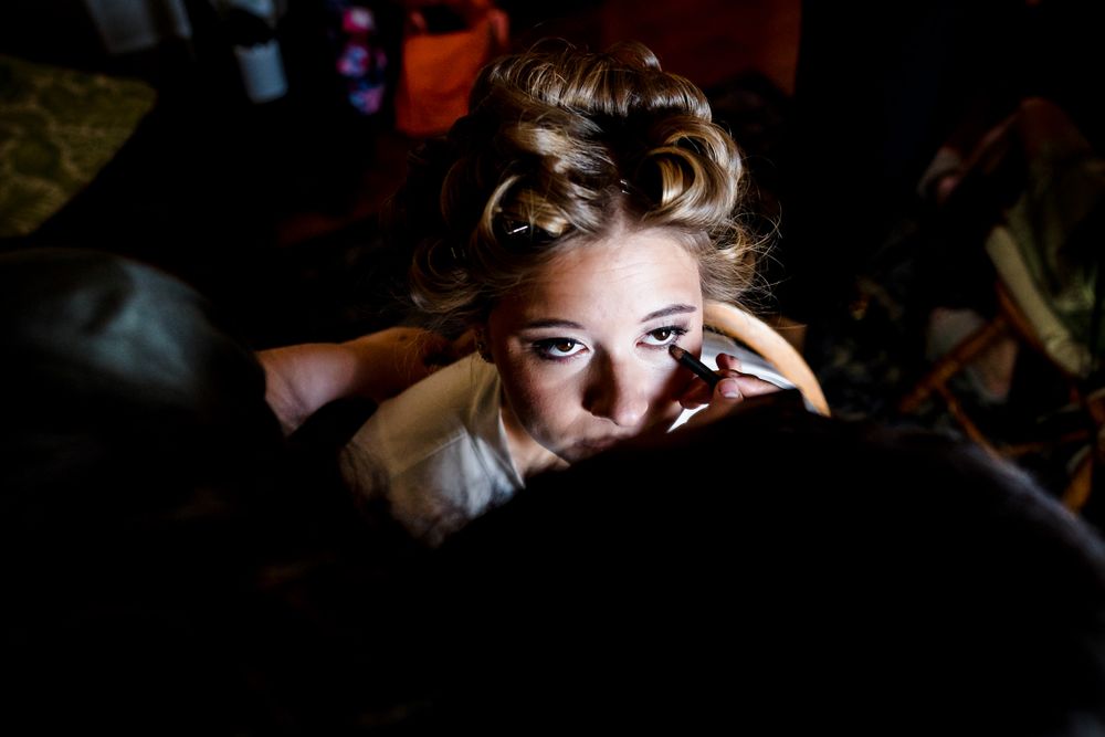 Moody low-key portrait with dramatic lighting and shadows.