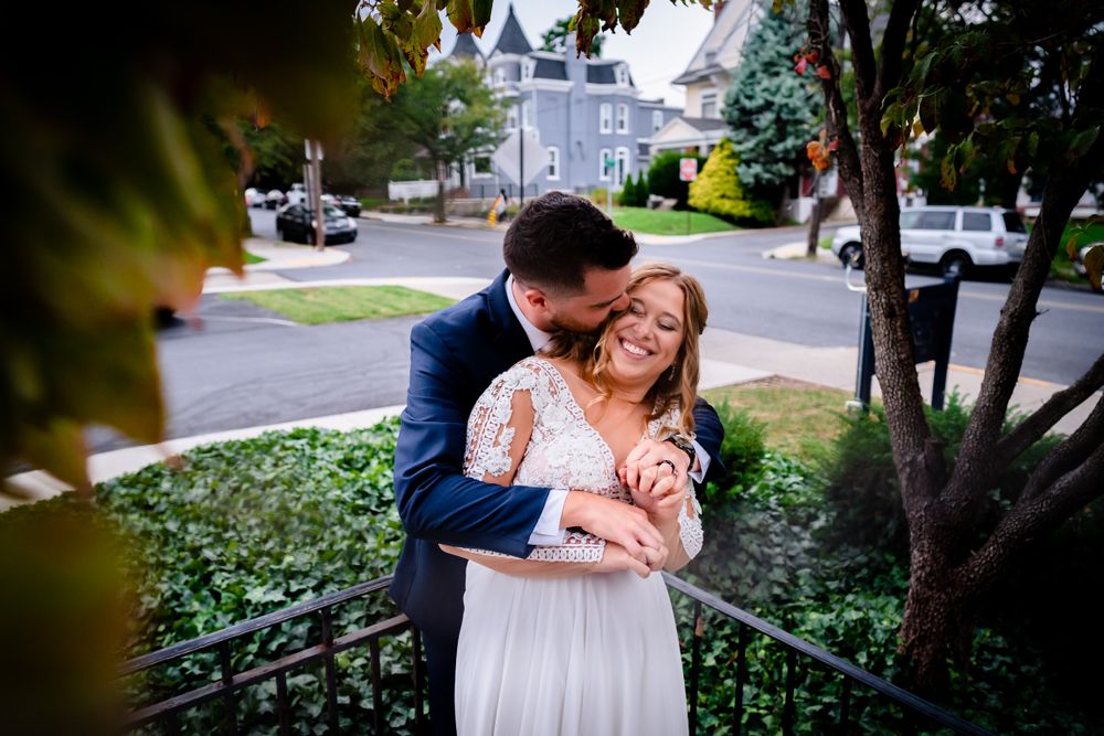 Wedding photography session in a lush garden setting with natural lighting.