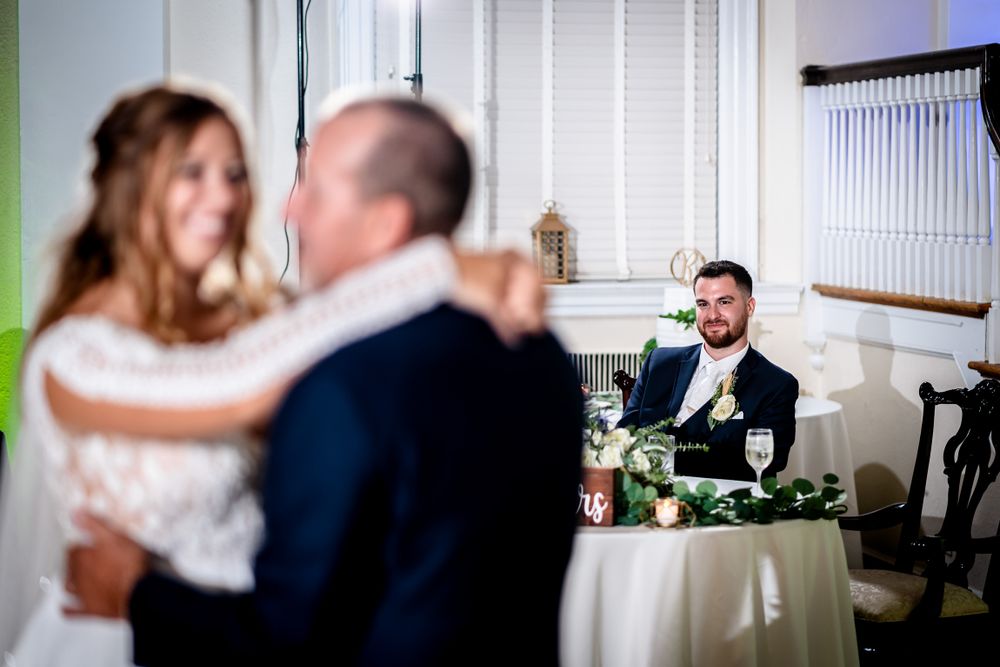 Intimate wedding moments captured in a series of candid photographs showing couples embracing.