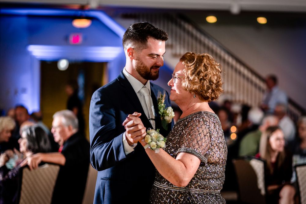 Wedding reception dance floor filled with guests enjoying the celebration.