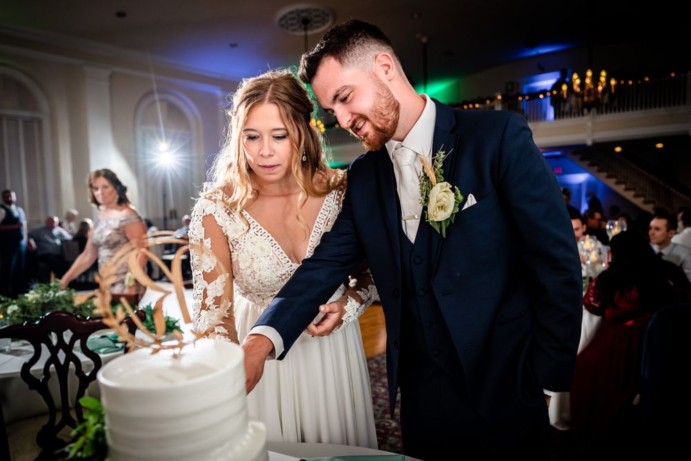 Couples sharing special moments during wedding reception activities and cake cutting.