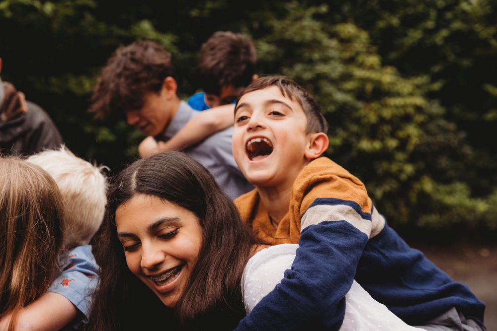 Candid moment of pure joy and laughter during a family gathering.