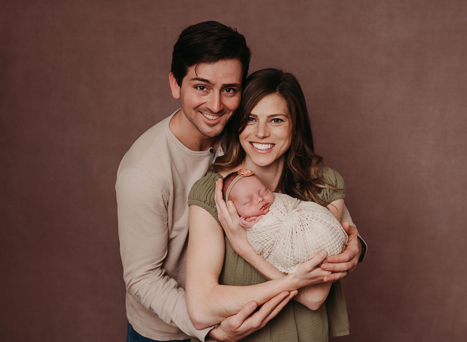 Family holding their newborn