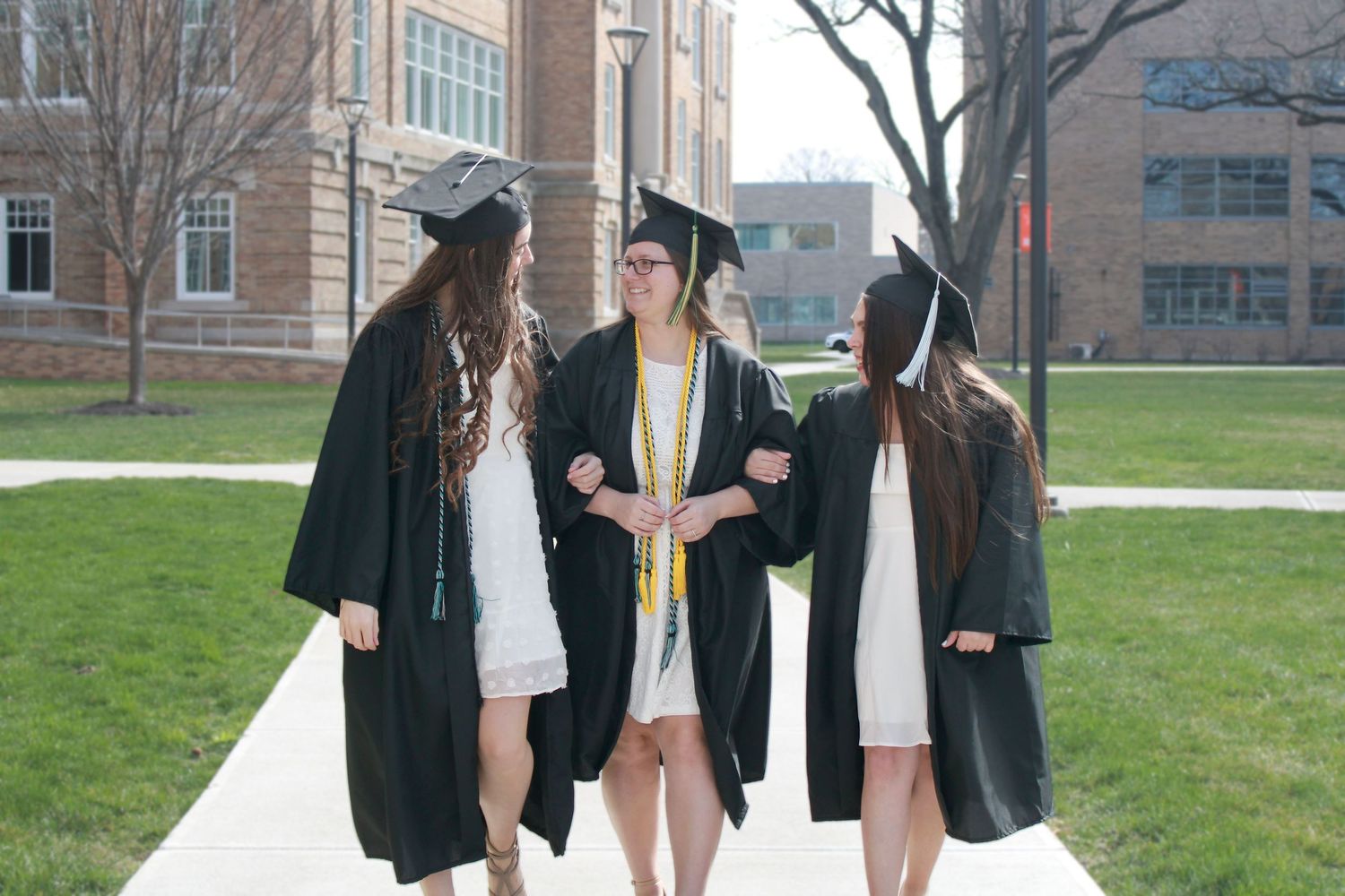 College graduates friends at graduation
