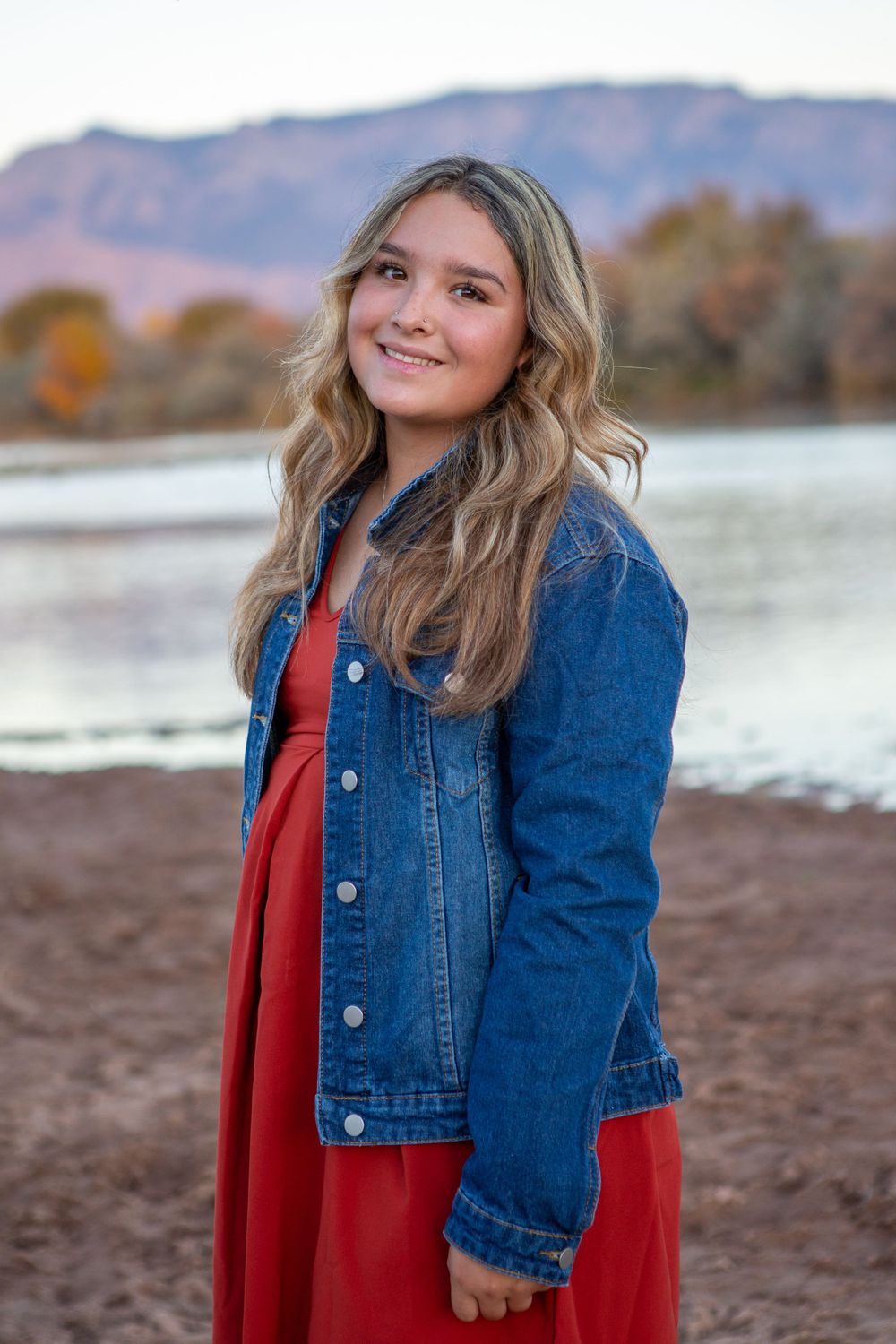 High School senior in front of the Sandias with river view